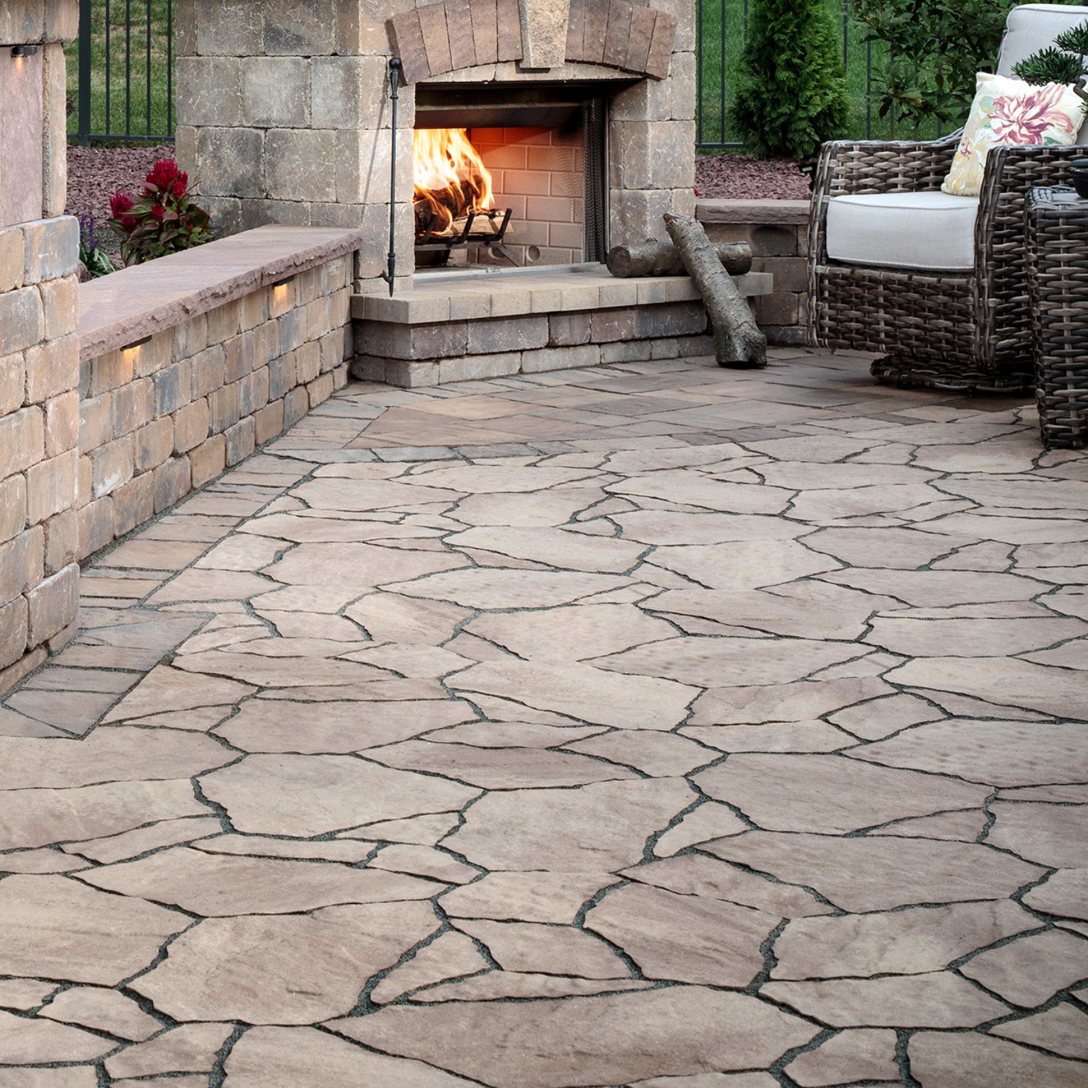 Patterned hardscape paving surrounding an outdoor fireplace