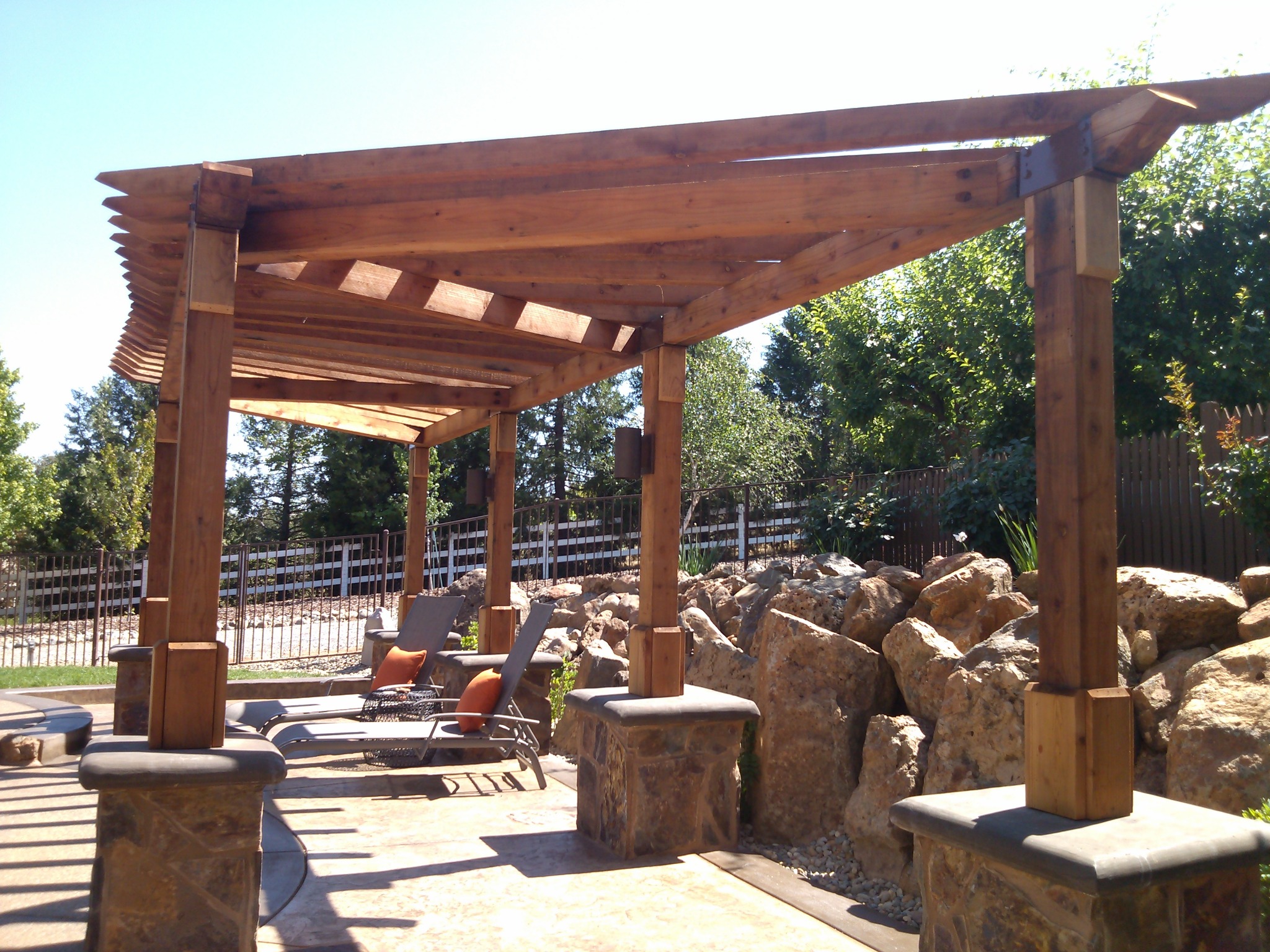 Wood pergola in a custom residential landscape