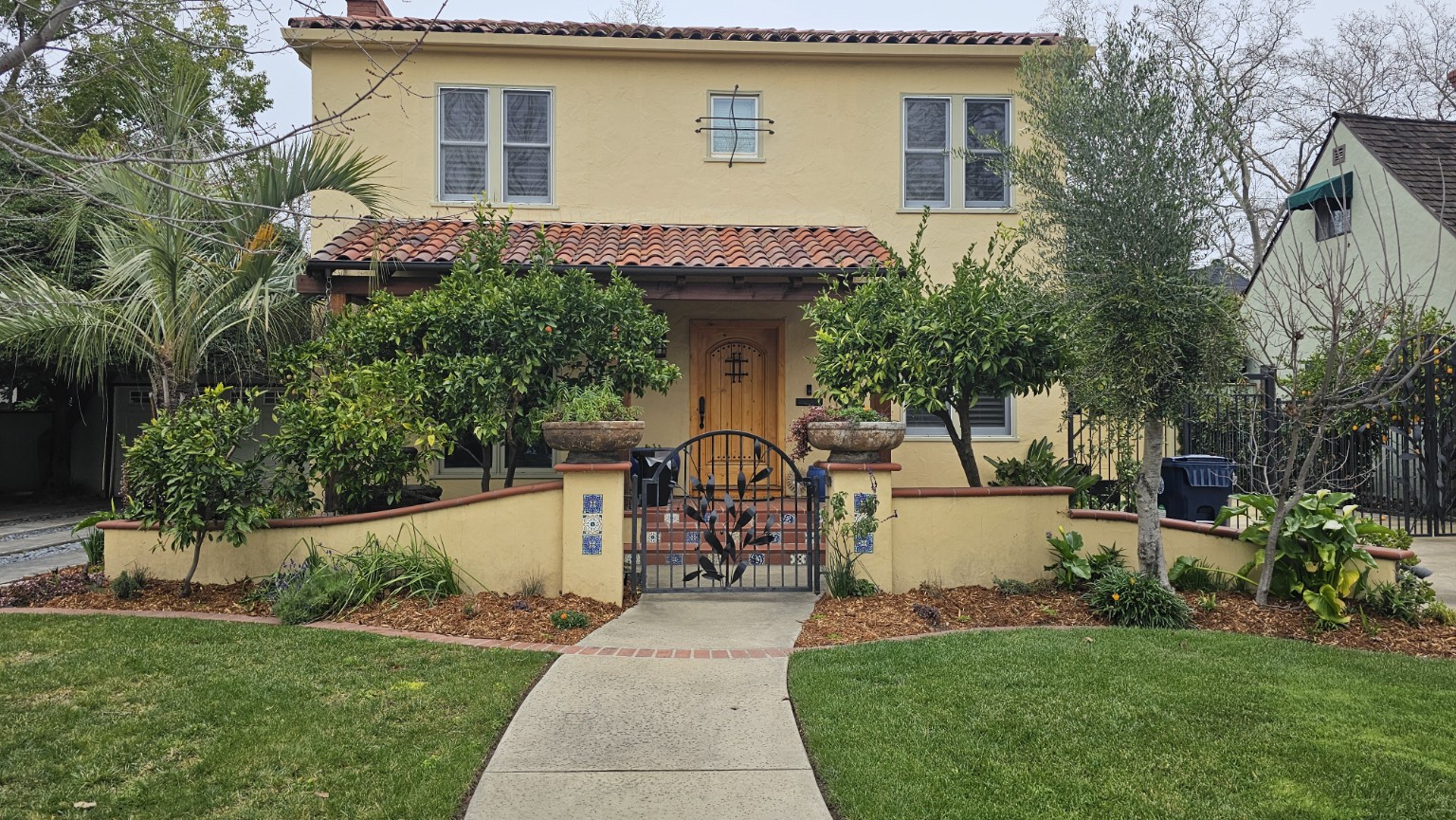 Mediterranean-inspired front yard planting coordinated with the architecture