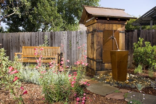 Artistic water feature integrated into a custom residential landscape